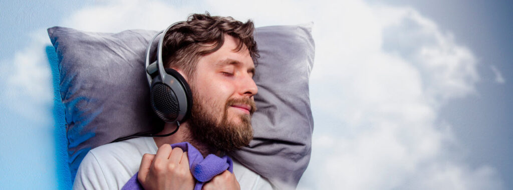 best noise cancelling headphones - man sleeping with headphones