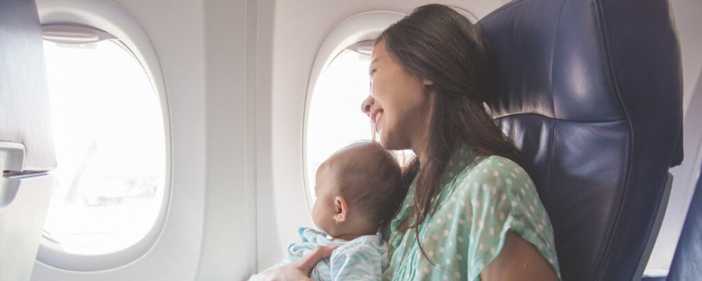 tips for flying with a baby - mother and baby on plane