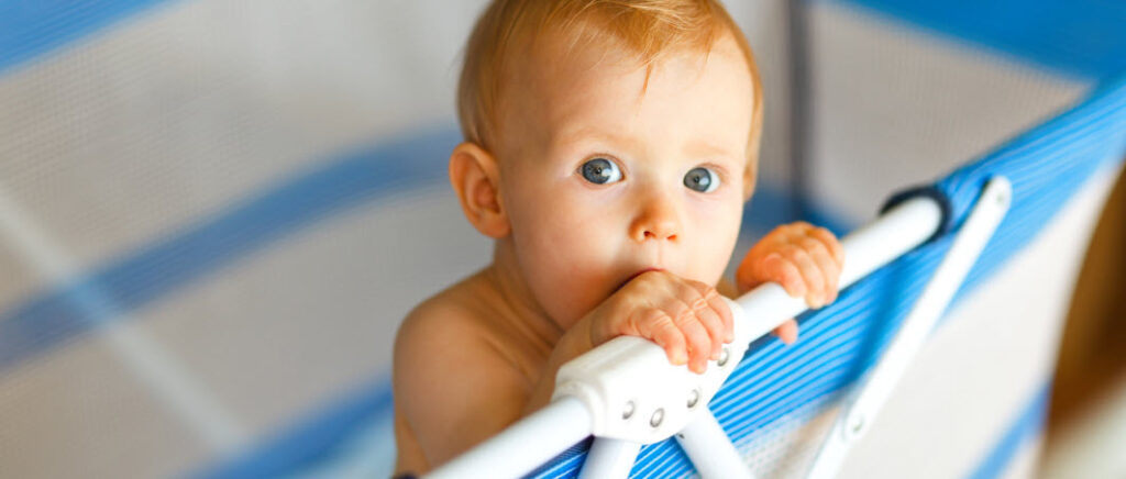 Portable Cots For Travel - toddler in portable cot
