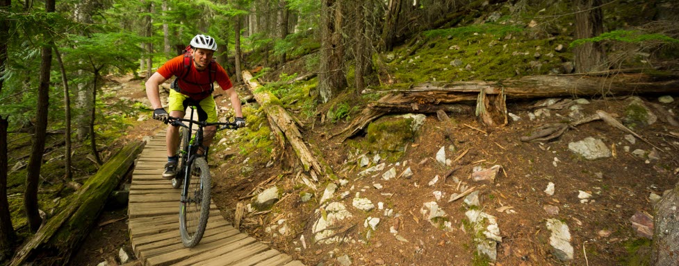 Best Mountain Bike Travel Cases - Man on mountain bike track