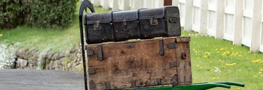 best travel trunks - old trunks on a wagon
