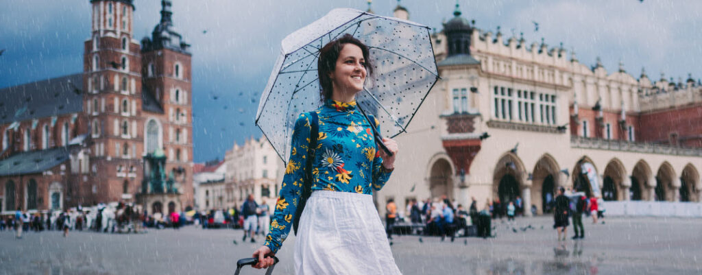 best travel umbrellas - girl traveling with umbrella